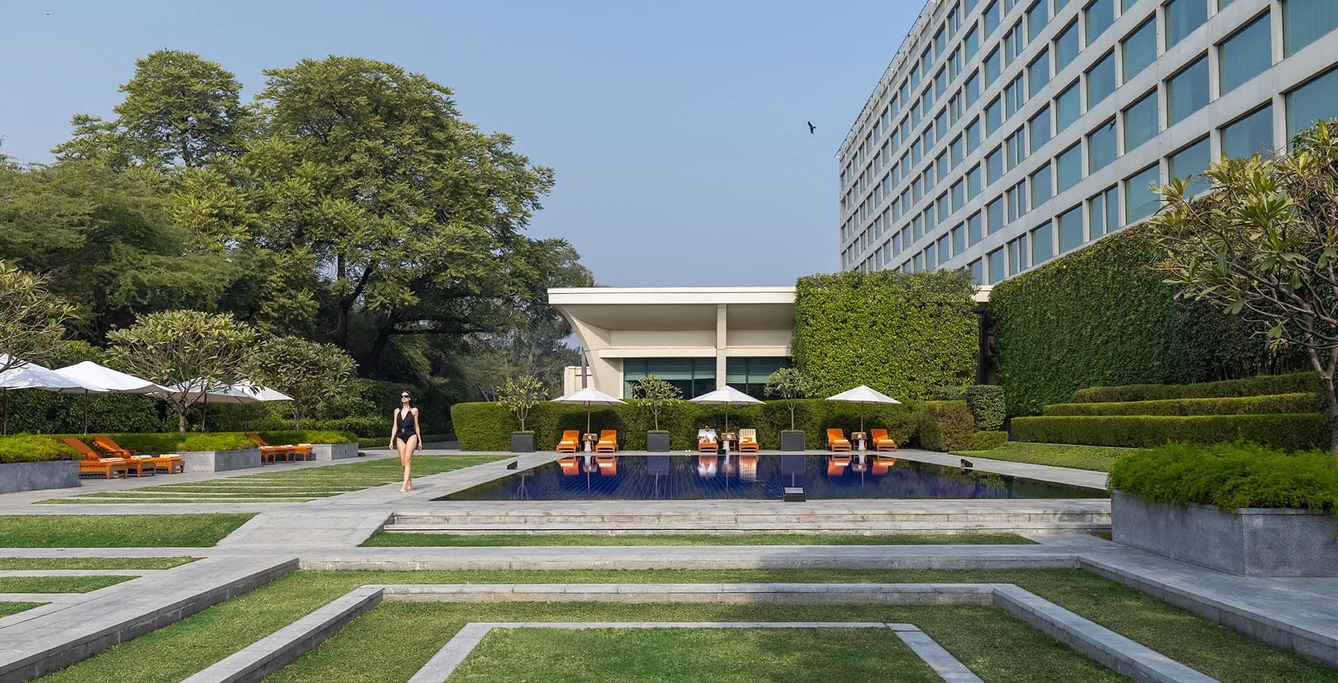 The landscaped garden and swimming pool at The Oberoi, New Delhi