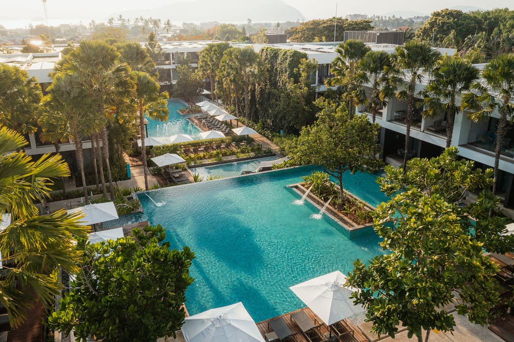 The palm-fringed swimming pools at STAY Wellbeing & Lifestyle Resort in Phuket