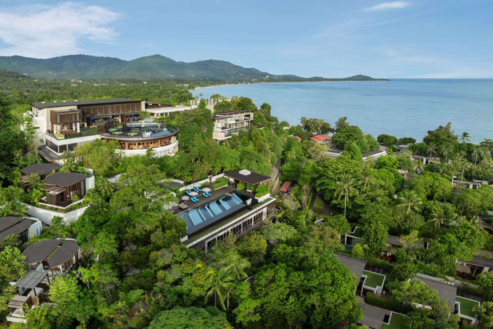 Aerial view of W Koh Samui's hillside villas and northern shoreline